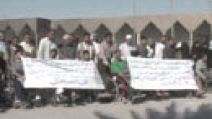 Iraqi demonstrators call for release of aid worker