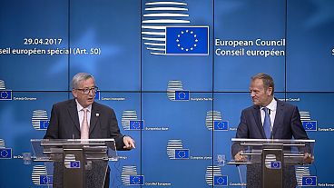 EU leaders approve tough terms for Brexit talks