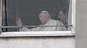 Pope appears at hospital window