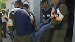 Israeli forces empty West Bank settlements without the expected violence