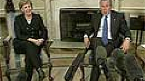 Bush and Merkel shoulder-to-shoulder on Iran
