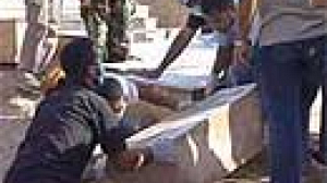 Villagers reclaim their dead from mass grave in Lebanon