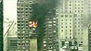 Panic in New York as plane crashes into building