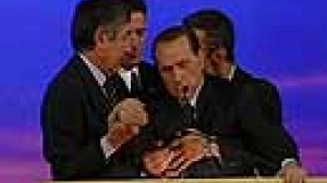 Berlusconi collapses at rally