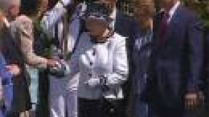 Britain’s Queen dines with the Bushes