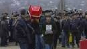 Families of Ukraine mine victims say a final goodbye