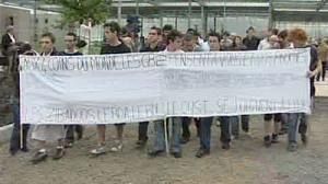 Students rally for French dead as suspect is held
