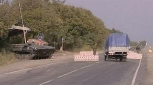 Conflicting reports of Russian pullout from Georgia
