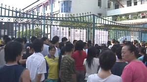 Unpaid staff step up protest at China toy plant