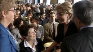 Widows from Italy’s era of civil conflict shake hands