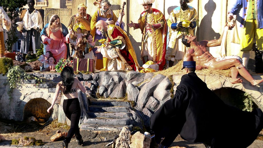 Topless Femen activist tries to grab baby Jesus from Vatican nativity scene