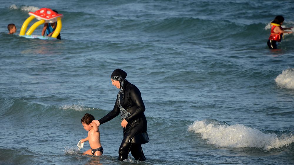 Protest in France after women fined for wearing 'burkini' swimsuits - NewsOpener Protest in France after women fined for wearing 'burkini' swimsuits