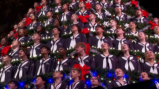 A choir inside a giant Christmas tree in the USA