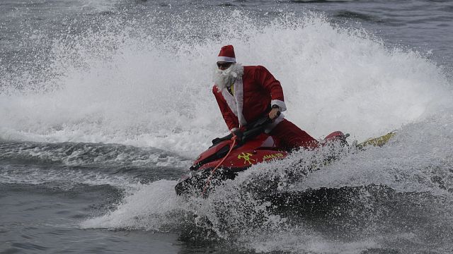 In Brazil, Santa arrives by jet ski