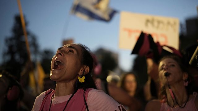 Police drag protesters from rails as Israelis rally for Gaza ceasefire