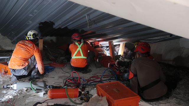 Rescue teams search for survivors after school building collapse in Indonesia