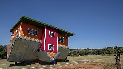 Roof down, floor up: South Africa's 'uʍop ǝpᴉsd∩' house attracts visitors