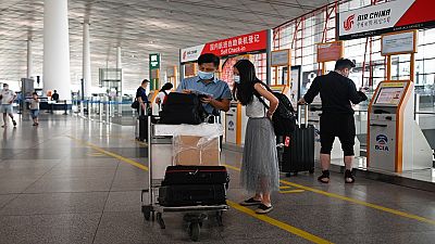Beijing cancels flights over new virus as second wave lingers