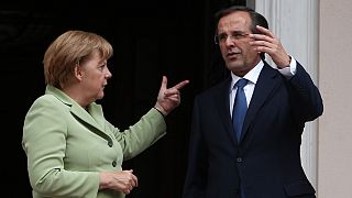 Atene accoglie Merkel a denti stretti