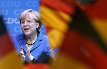 Merkel triumphs but falls just shy of absolute majority