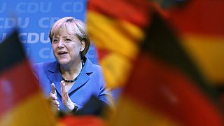 Merkel triumphs but falls just shy of absolute majority