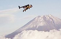 Spectacular: 'Jetman' Yves Rossi flies past Mount Fuji in Japan