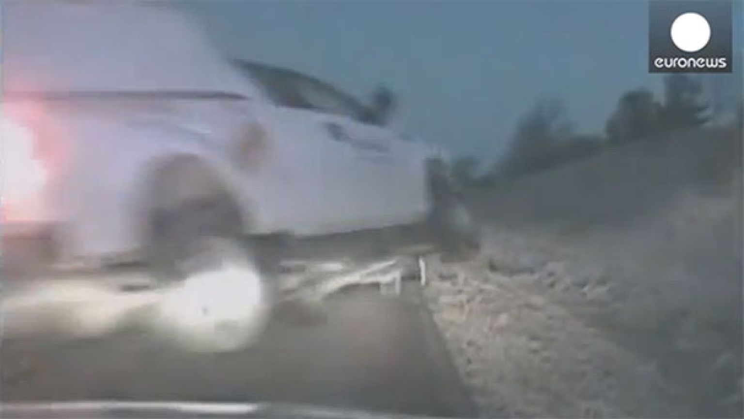 Watch: Crashing pick-up truck flies threw air just missing police officer