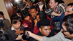 Missing flight MH370: grieving families receive first compensation payouts
