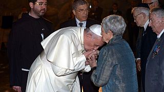 Pope Francis kisses hands of Holocaust survivors