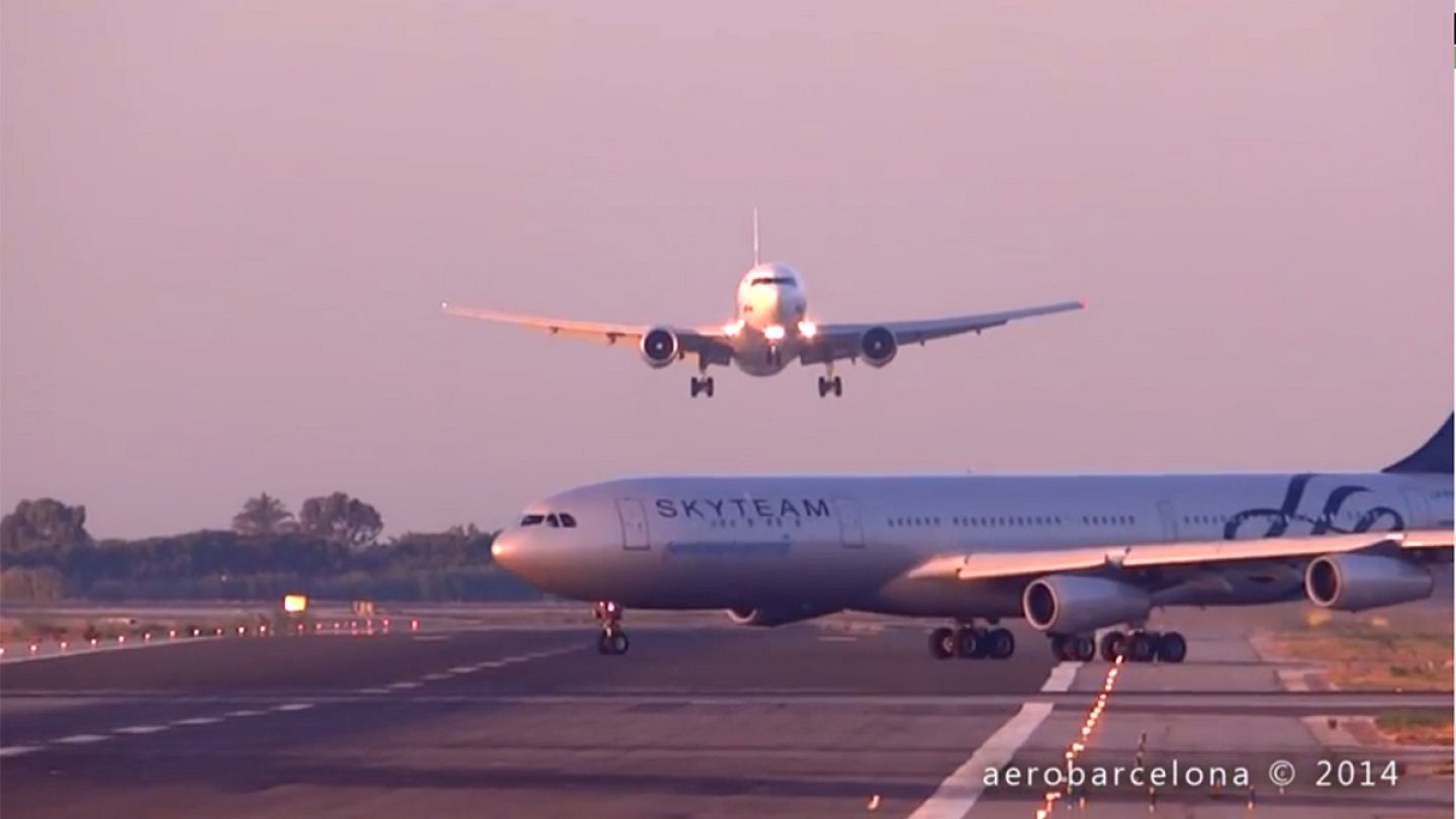 Amateur video shows two planes in near miss at Barcelona airport