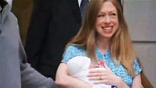 Video: Chelsea Clinton presents baby Charlotte alongside proud grandparents Bill and Hillary