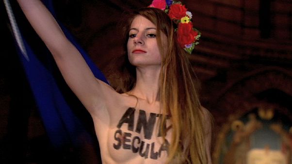 Femen lay bare their naked opposition to papal visit Femen lay bare their naked opposition to papal visit