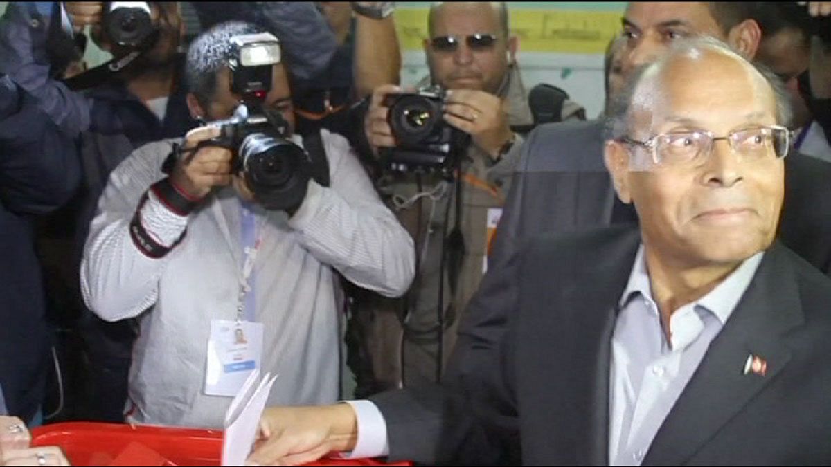 Close run-off expected after Tunisia's historic presidential poll