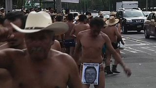 Mexican farmers strip-off against alleged abuse of power