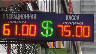 Rouble's fall sends Russians rushing to shops to buy before prices rise