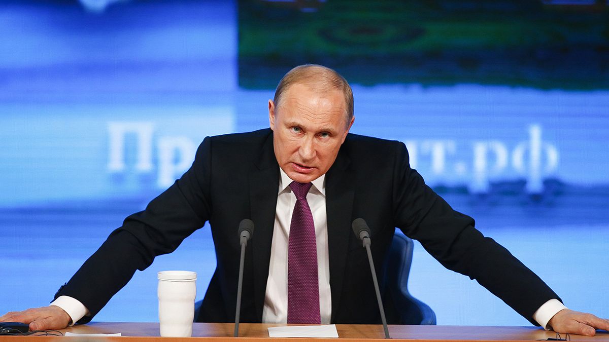 Putin tries to reassure over rouble worries, but also slams the West