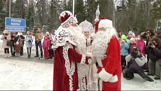 Father Christmases meet at Russia-Finland border