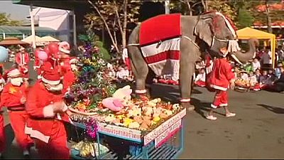 Elephants give Christmas joy to Thai children
