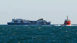 Burned-out Norman Atlantic ferry waits to moor at Italian port Brindisi