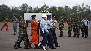 Airbus tail fin found as weather eases in AirAsia salvage