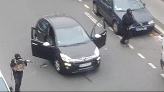 Hooded gunman storm the Paris offices of satirical magazine Charlie Hebdo