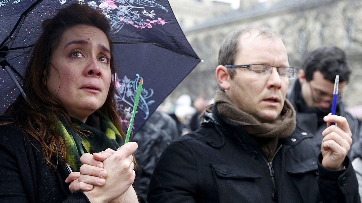 Francois Hollande leads a minute of silence for a nation in mourning