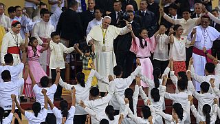 Near-record numbers at open-air mass led by the Pope in Manila