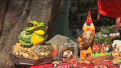 Bolivians celebrate Ekeko, god of abundance, at Alasitas Fair