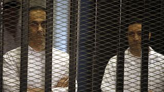 Mubarak sons released from jail in Egypt pending retrial