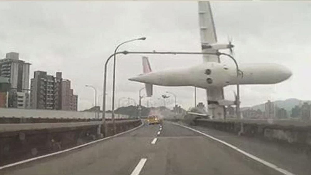 Taiwanese plane clips highway and plunges into river: ten killed