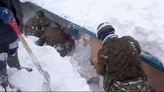 Japanese troops work to relieve town cut off by record snowfall