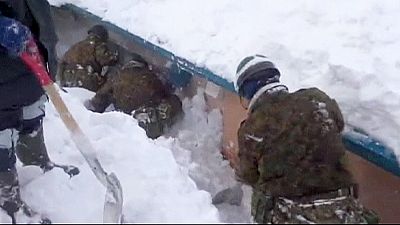 Japanese troops work to relieve town cut off by record snowfall