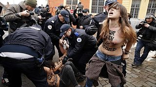[Pictures] FEMEN's topless protest as Strauss-Kahn arrives for trial over alleged pimping