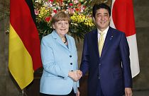 Visiting Merkel reminds Japan to confront wartime past